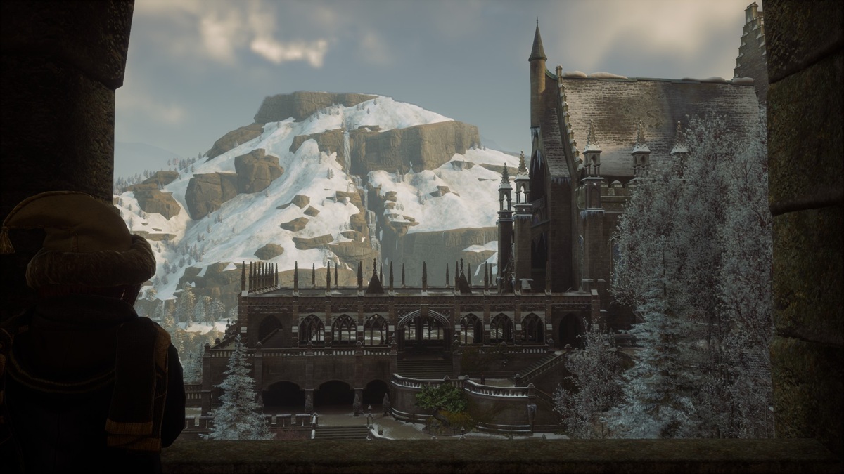 Student stands and watches the Hogwarts courtyard wistfully.