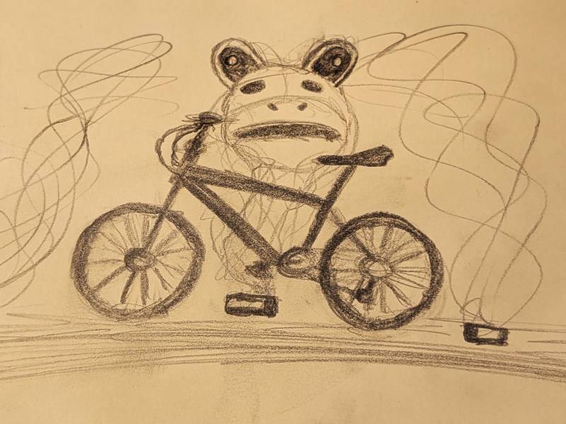 casual ramble about naked bike ride sketch of a bike surround by tear gas canisters and a frog costume